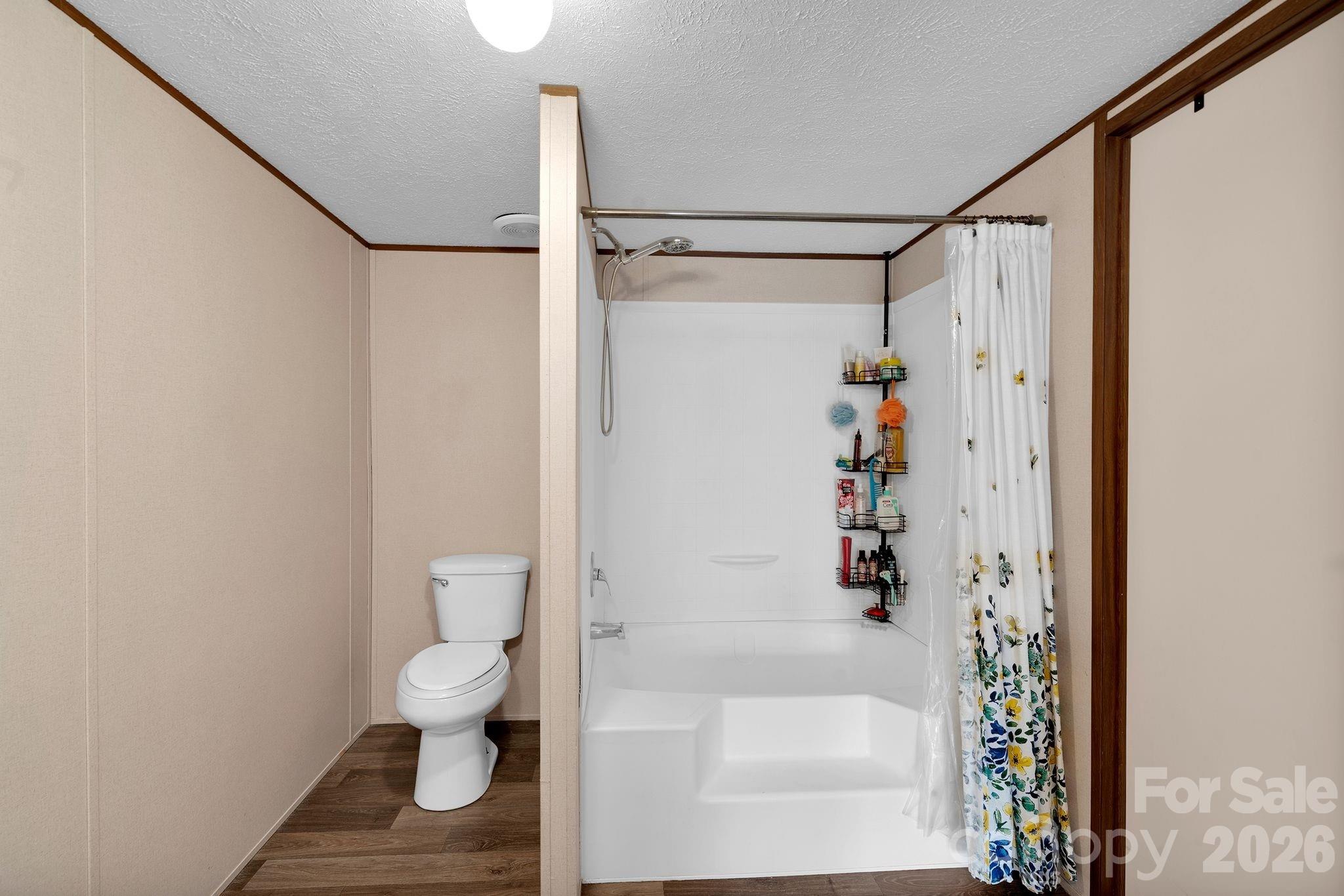 812 Dallas Spencer Mountain Road Dallas, NC 28034 - Photo 26 of 35 a bathroom with a shower and a toilet
