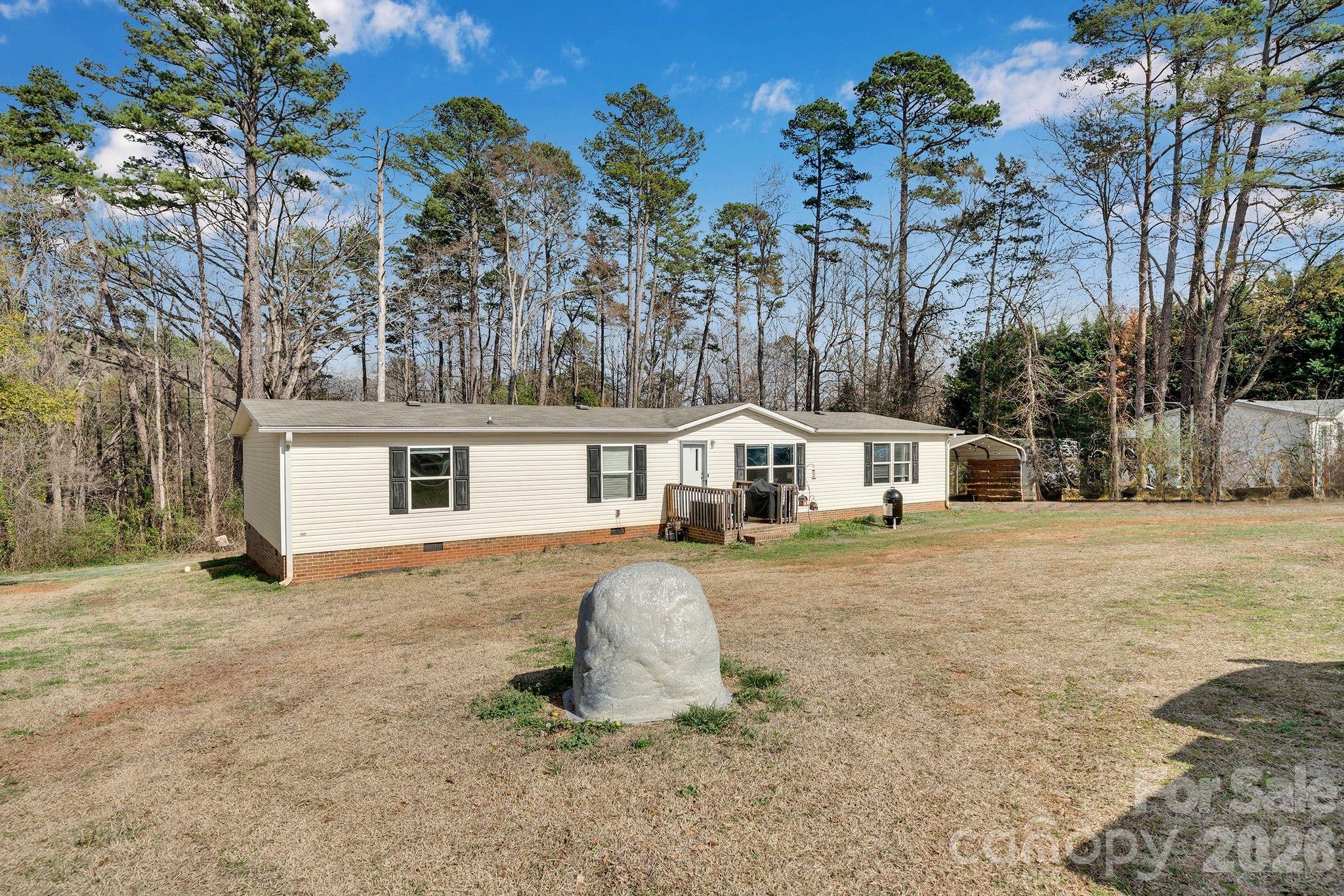 812 Dallas Spencer Mountain Road Dallas, NC 28034 - Photo 27 of 35 a front view of a house with a garden