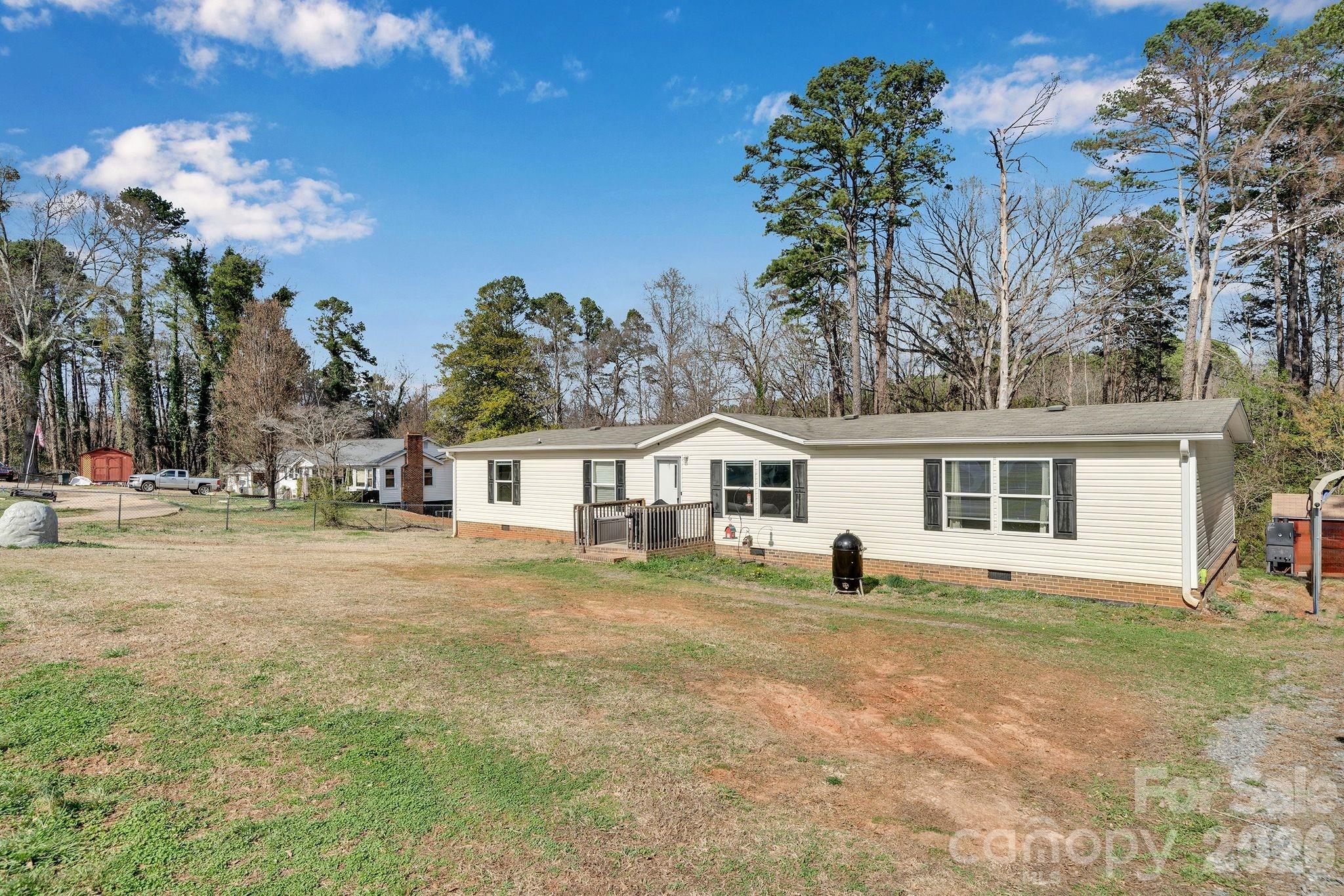 812 Dallas Spencer Mountain Road Dallas, NC 28034 - Photo 28 of 35 a front view of a house with a yard