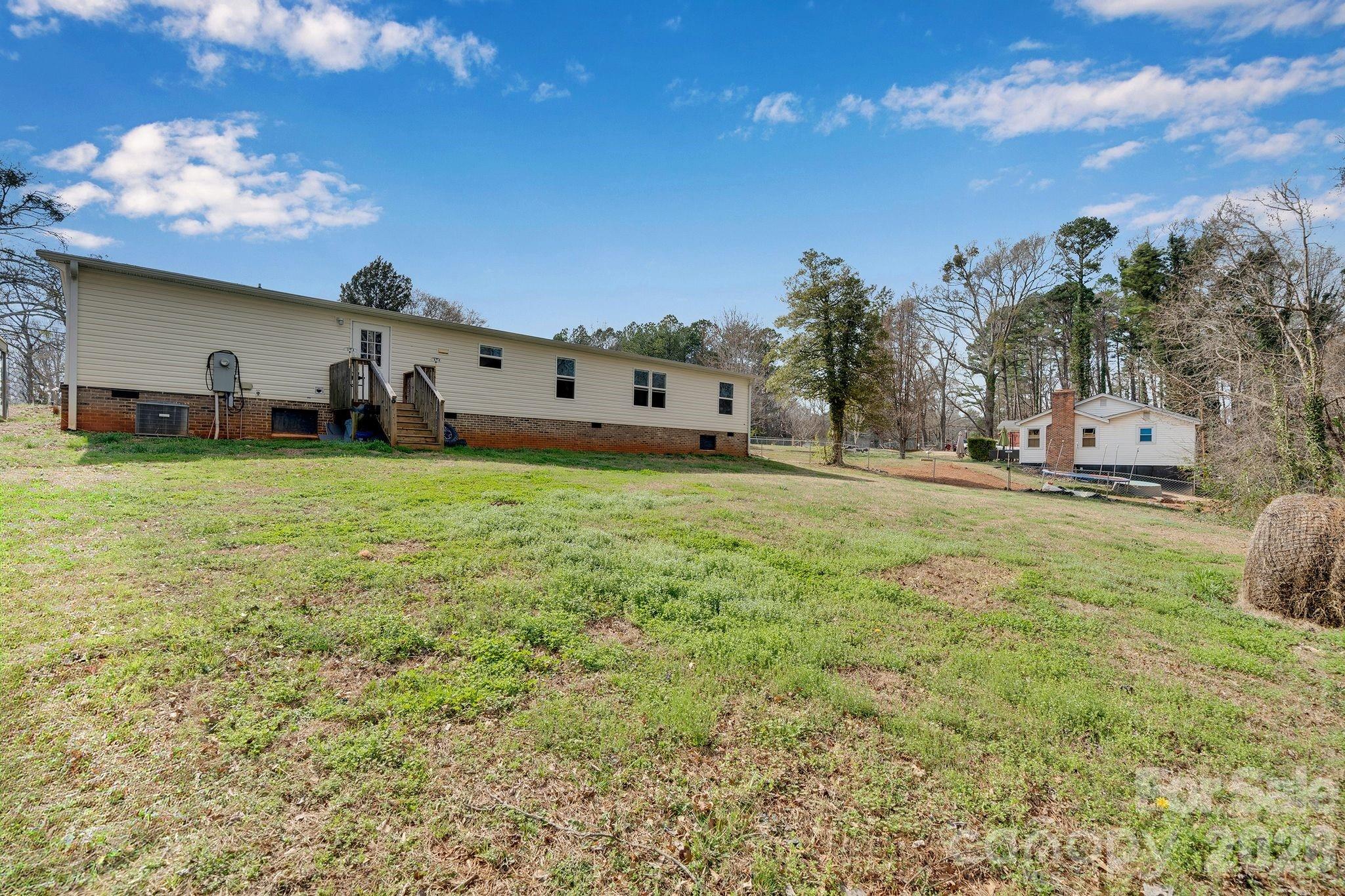 812 Dallas Spencer Mountain Road Dallas, NC 28034 - Photo 29 of 35 a view of a house with a big yard