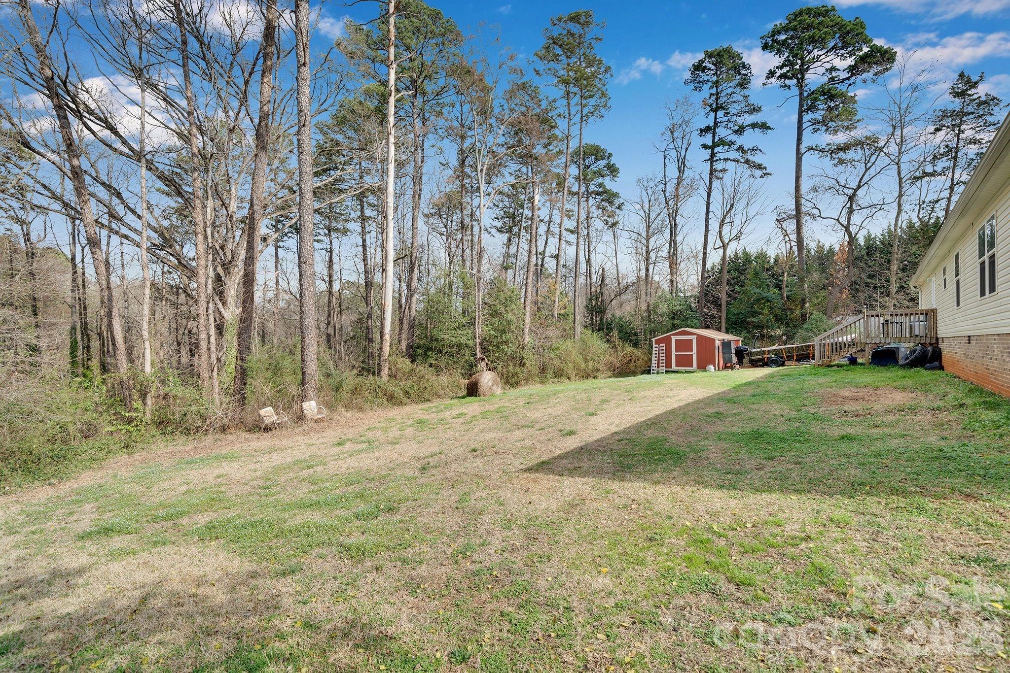 812 Dallas Spencer Mountain Road Dallas, NC 28034 - Photo 31 of 35 a view of a field with a tree in the background