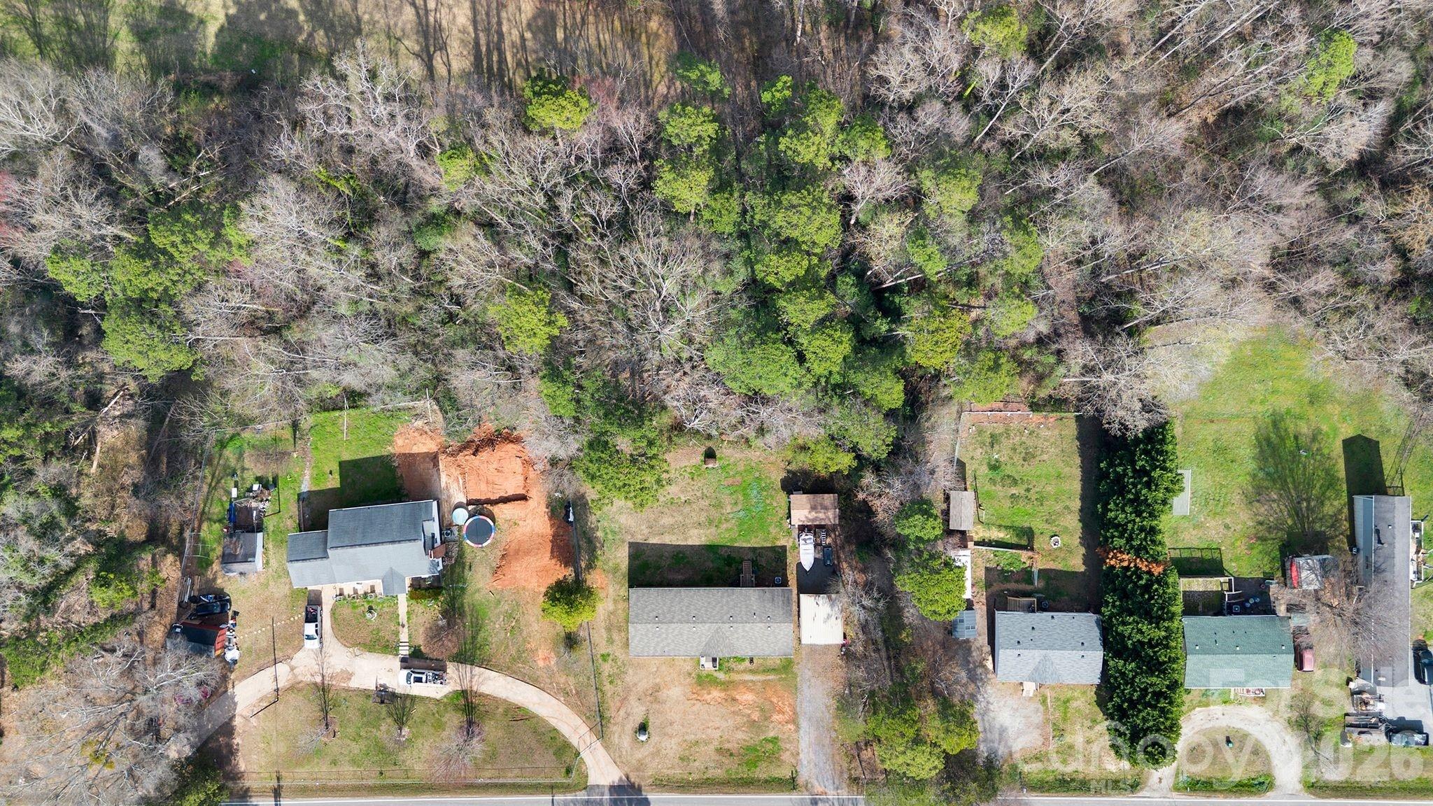 812 Dallas Spencer Mountain Road Dallas, NC 28034 - Photo 33 of 35 an aerial view of residential houses with outdoor space
