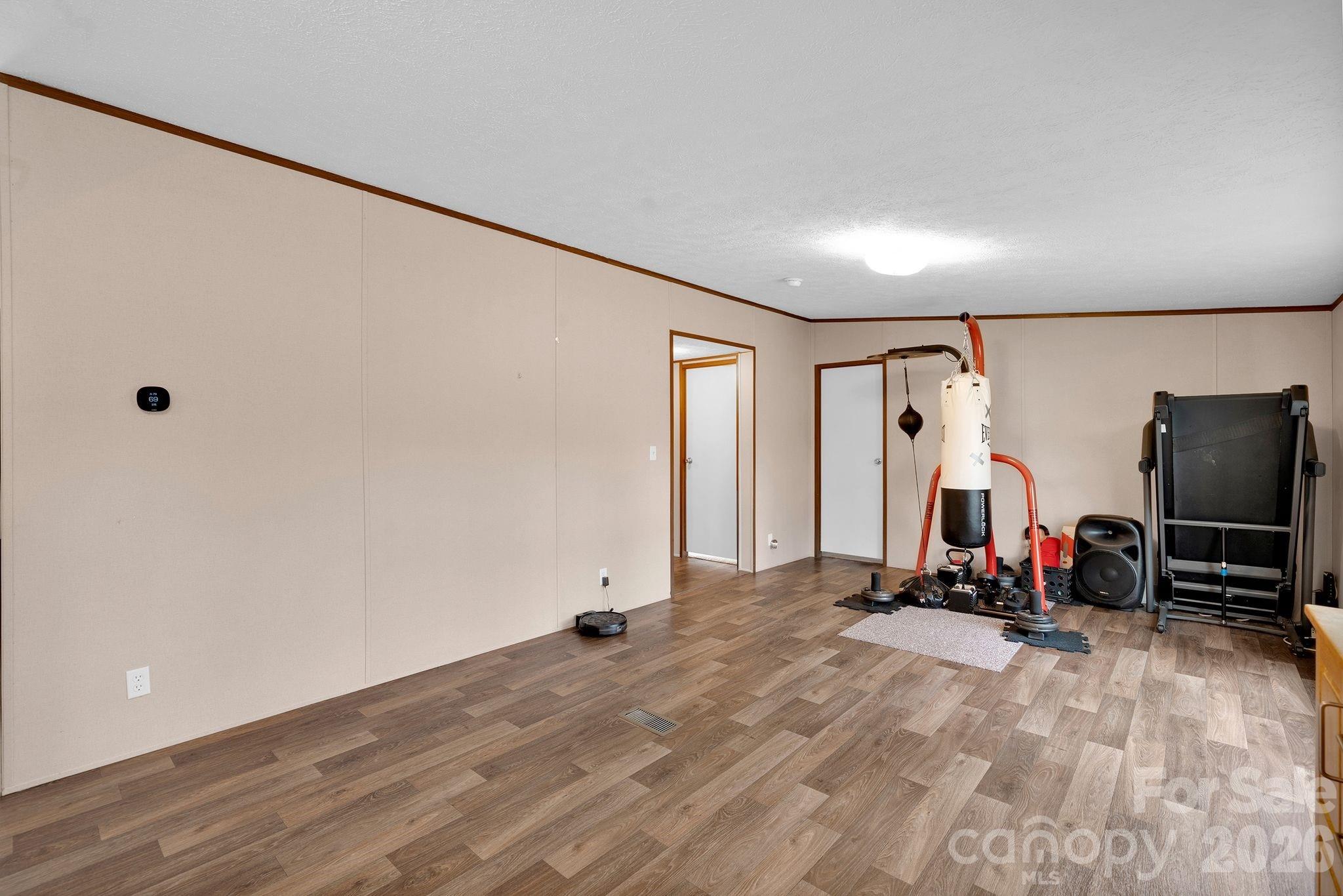 812 Dallas Spencer Mountain Road Dallas, NC 28034 - Photo 10 of 35 a view of a room with gym equipment