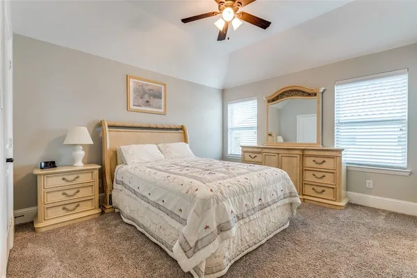 a bedroom with a bed and a cabinets