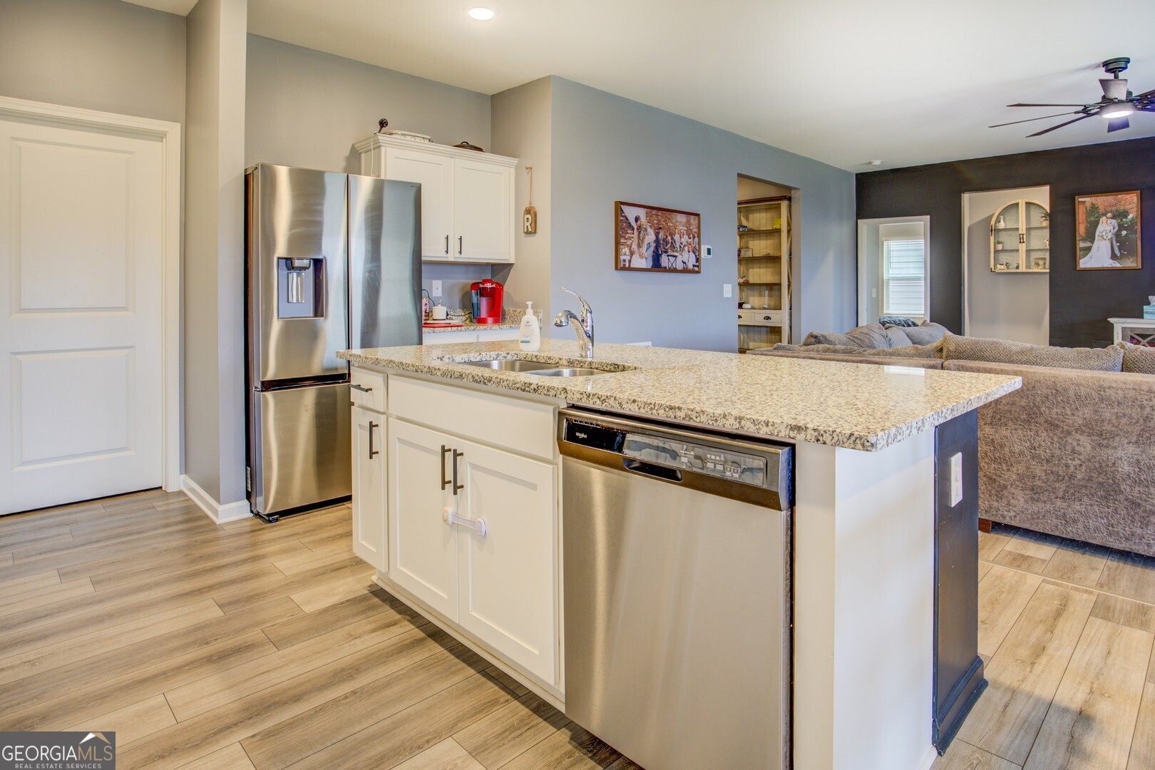 39 Dorsey Way Monroe, GA 30655 - Photo 17 of 44 a kitchen with stainless steel appliances granite countertop a sink and a refrigerator