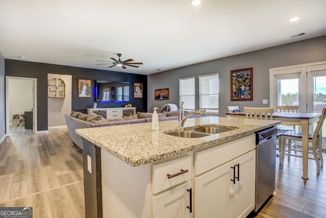 a kitchen with center island and center island