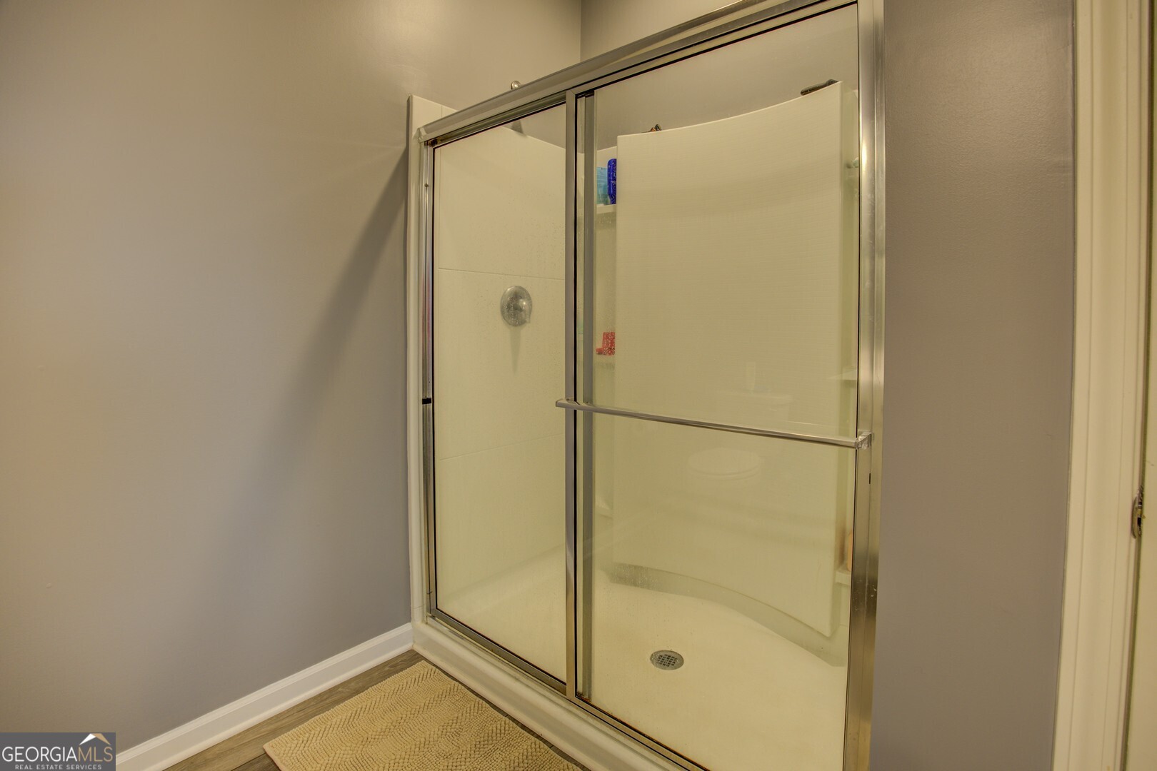 39 Dorsey Way Monroe, GA 30655 - Photo 24 of 44 a bathroom with a glass shower door