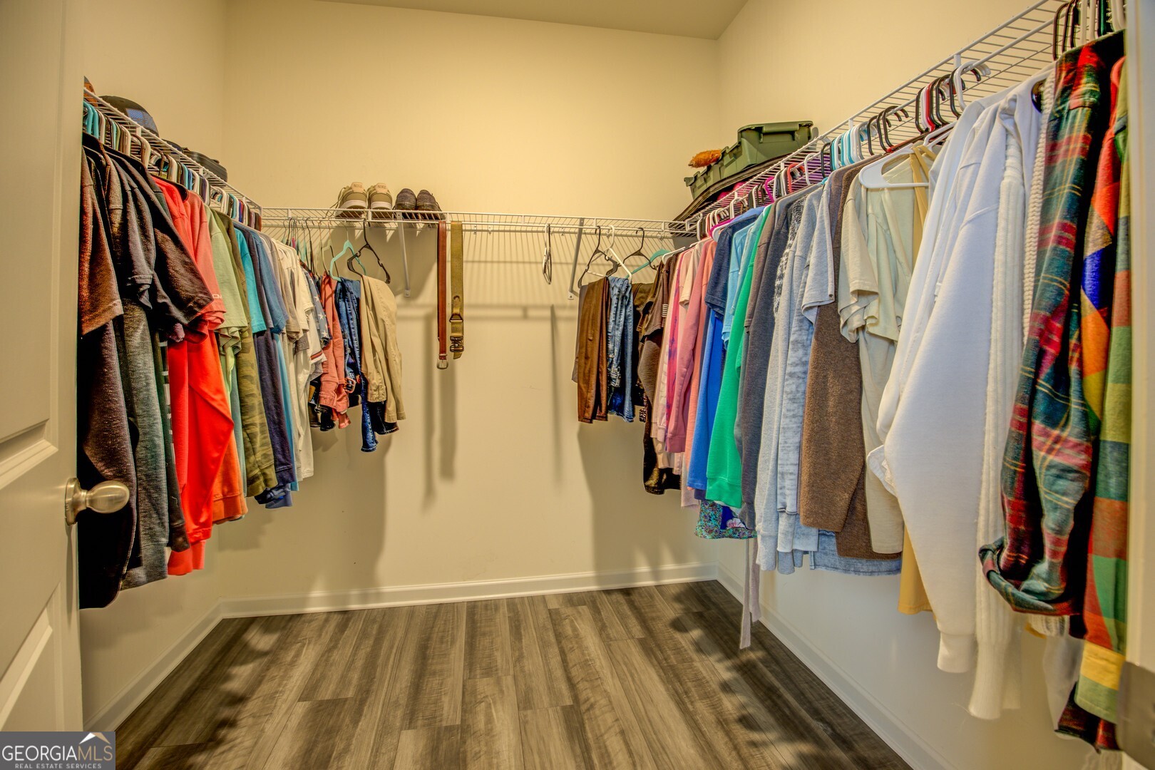 39 Dorsey Way Monroe, GA 30655 - Photo 27 of 44 a view of walk in closet with clothes and shoes