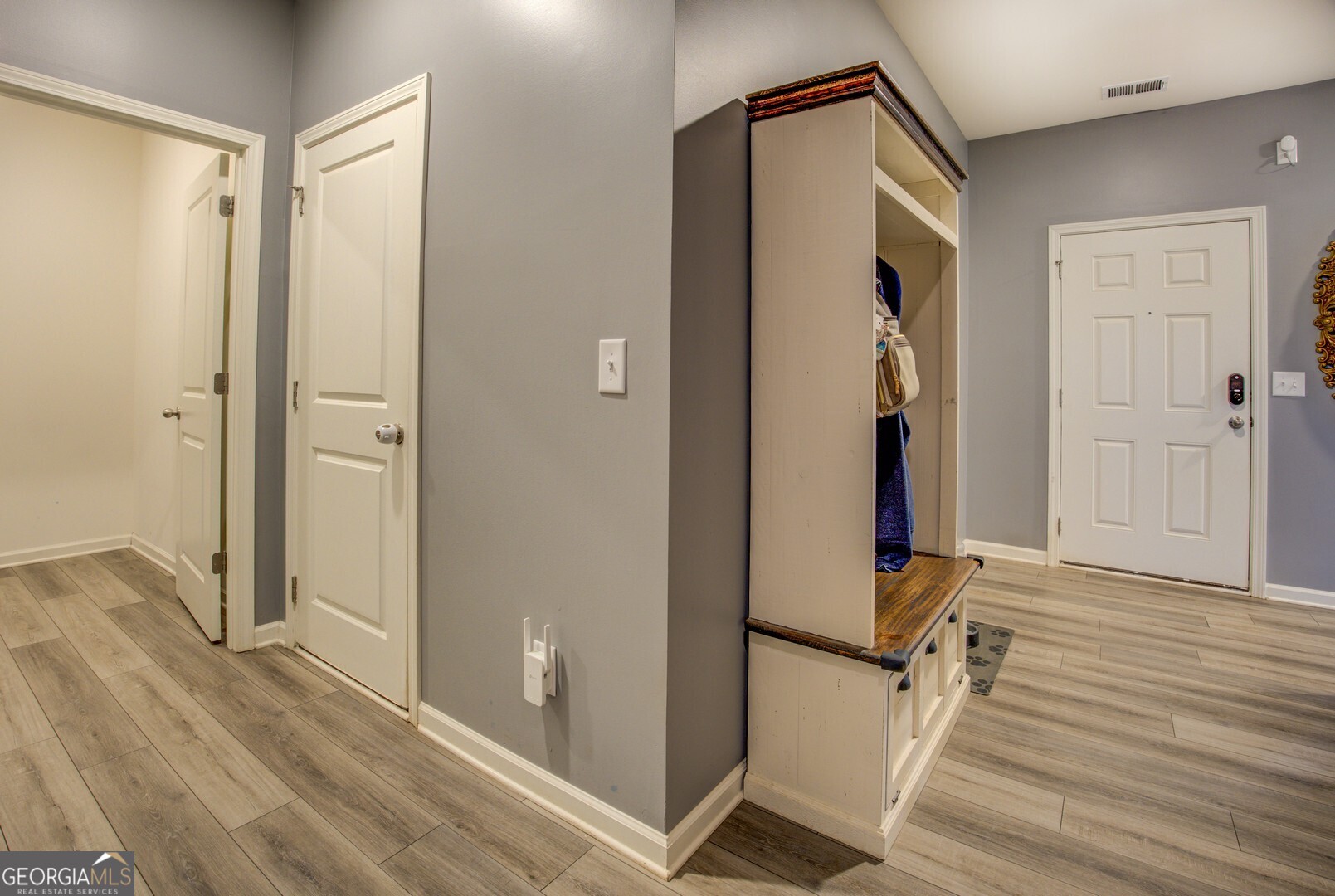 39 Dorsey Way Monroe, GA 30655 - Photo 9 of 44 a view of a hallway with wooden floor and staircase