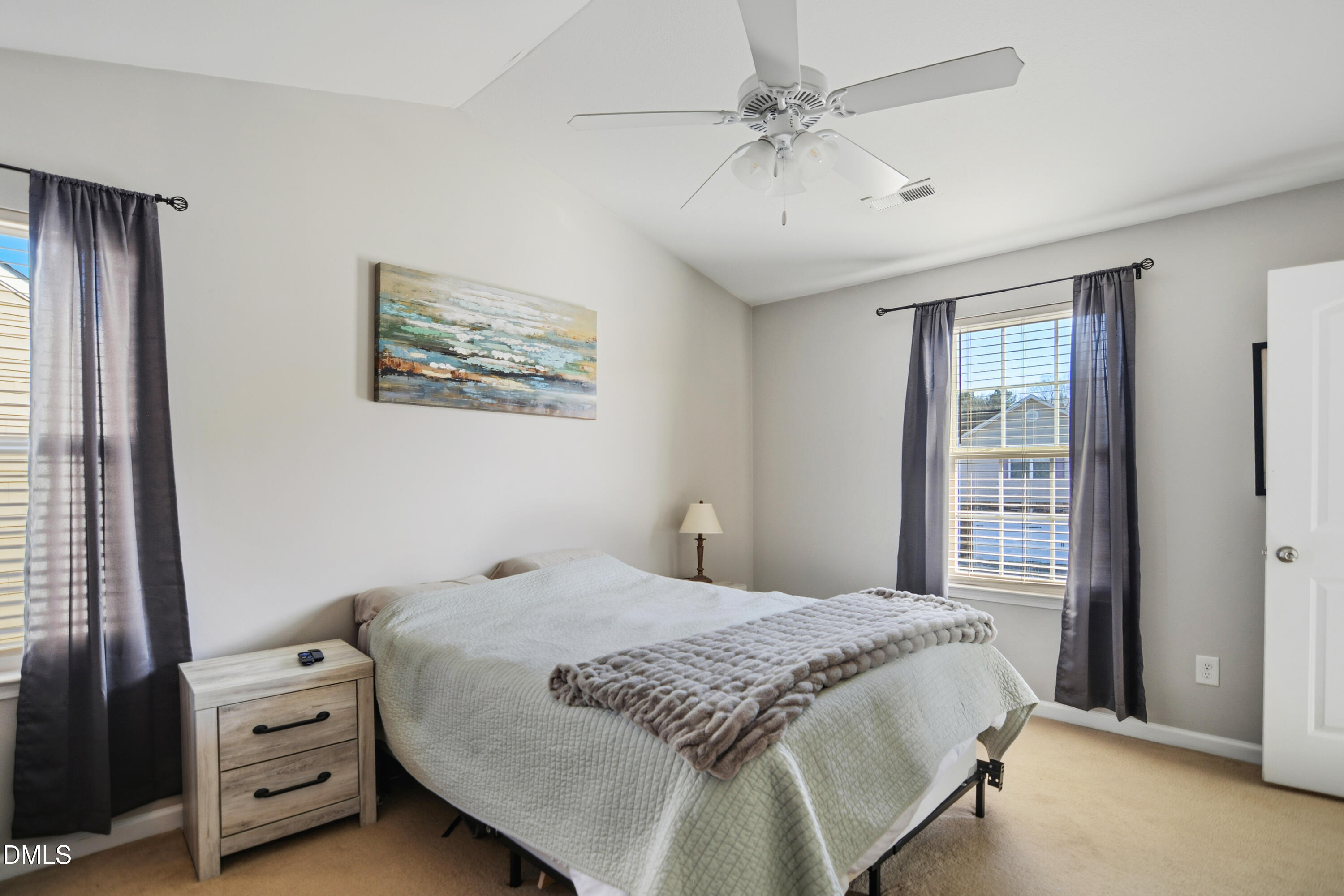 Undisclosed Address Durham, NC 27704 - Photo 11 of 21 a bedroom with a bed a dresser and a window