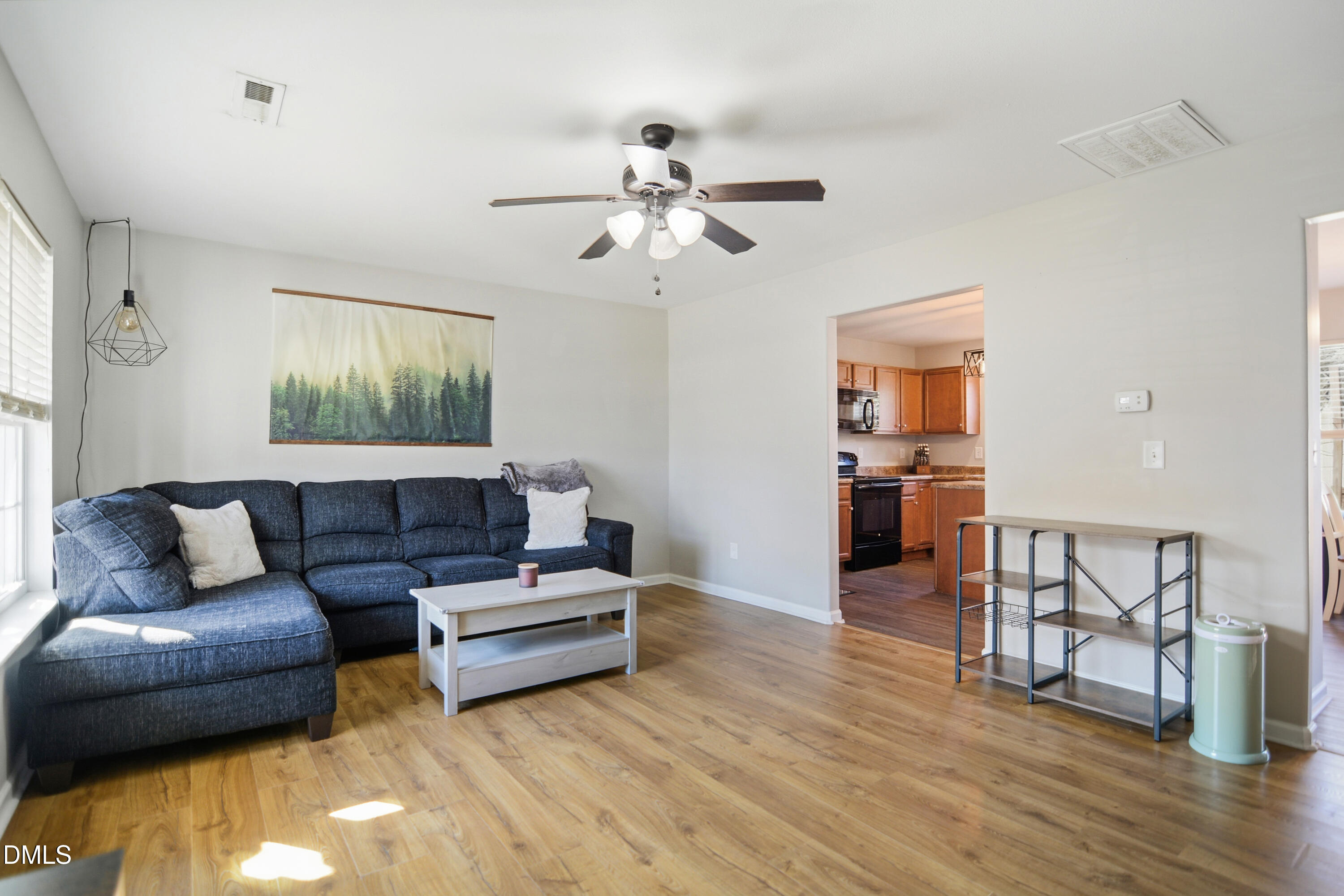 Undisclosed Address Durham, NC 27704 - Photo 4 of 21 a living room with furniture and kitchen view