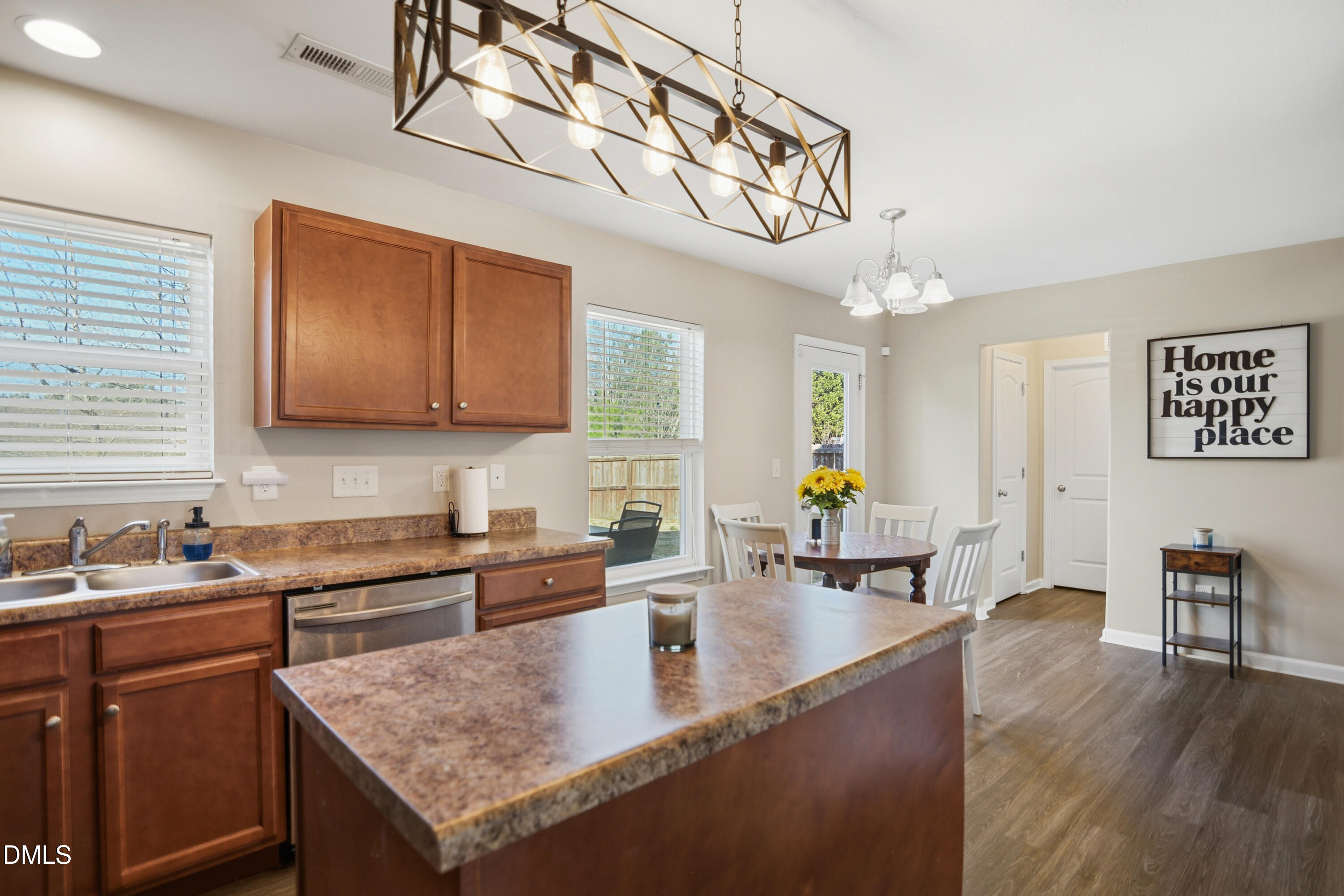Undisclosed Address Durham, NC 27704 - Photo 8 of 21 a kitchen with a sink a counter space cabinets and stainless steel appliances