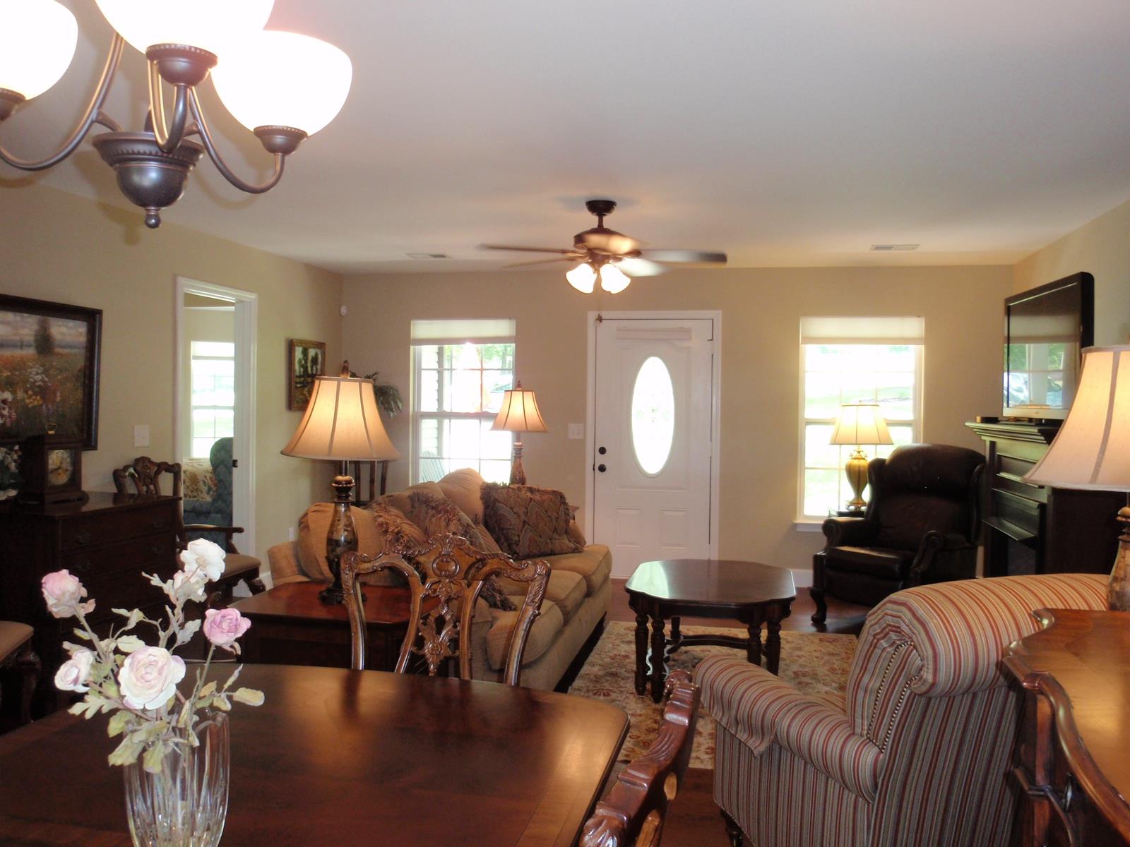206 Black Road Dickson, TN 37055 - Photo 11 of 22 a living room with furniture chandelier and a mirror