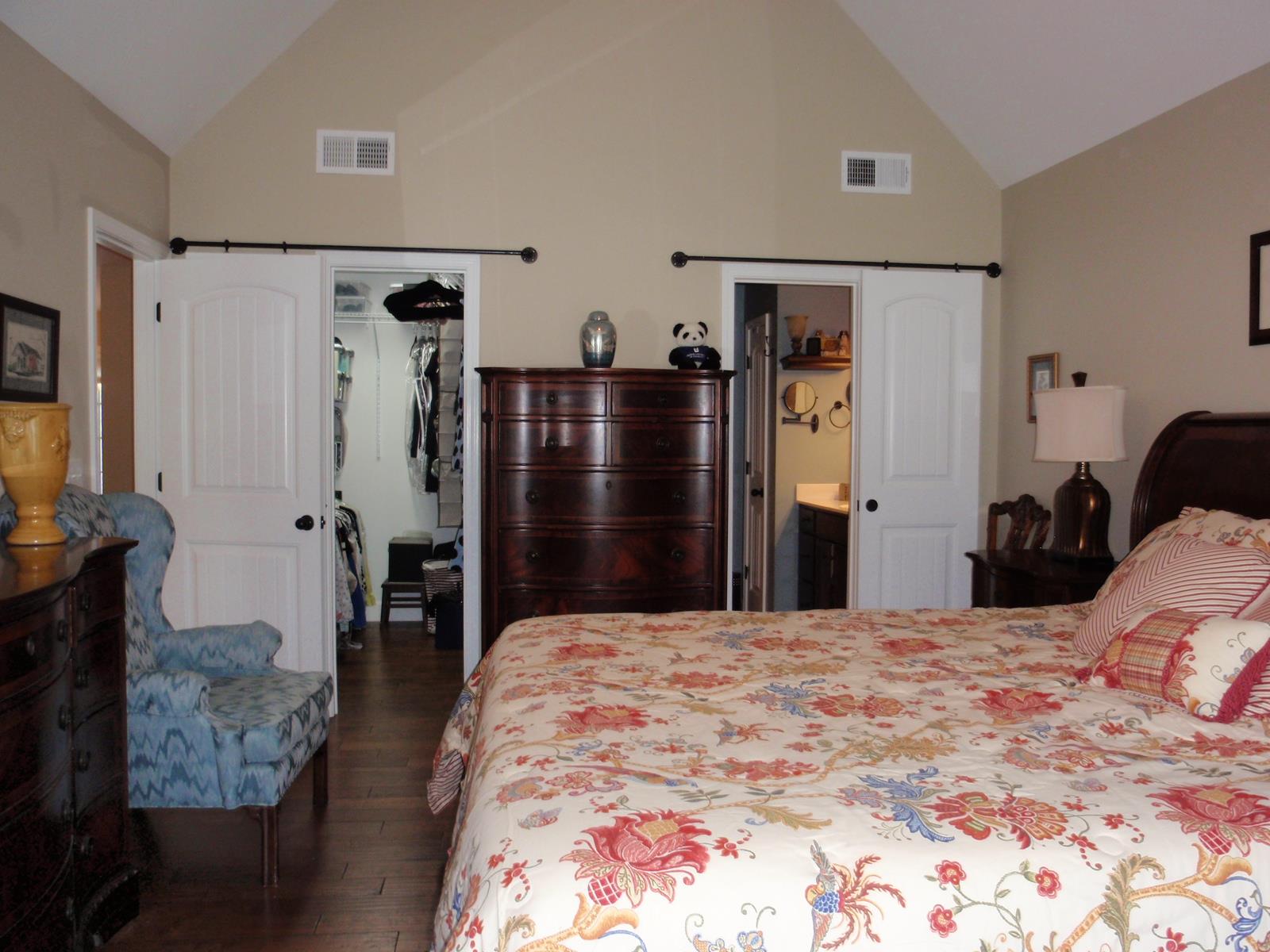 206 Black Road Dickson, TN 37055 - Photo 17 of 22 a large bedroom with a bed and wooden floor