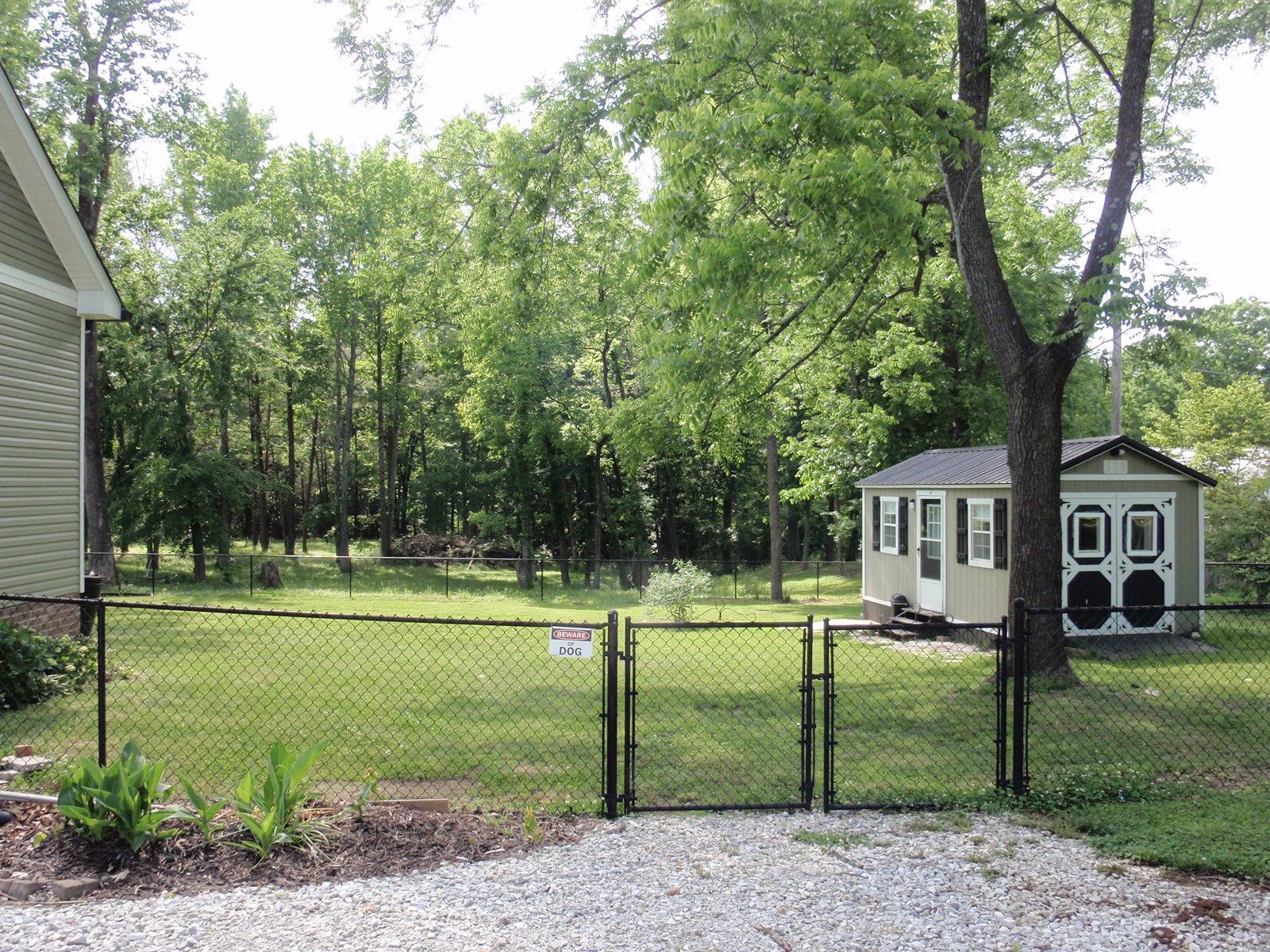 206 Black Road Dickson, TN 37055 - Photo 4 of 22 a view of a house with a yard and a large tree