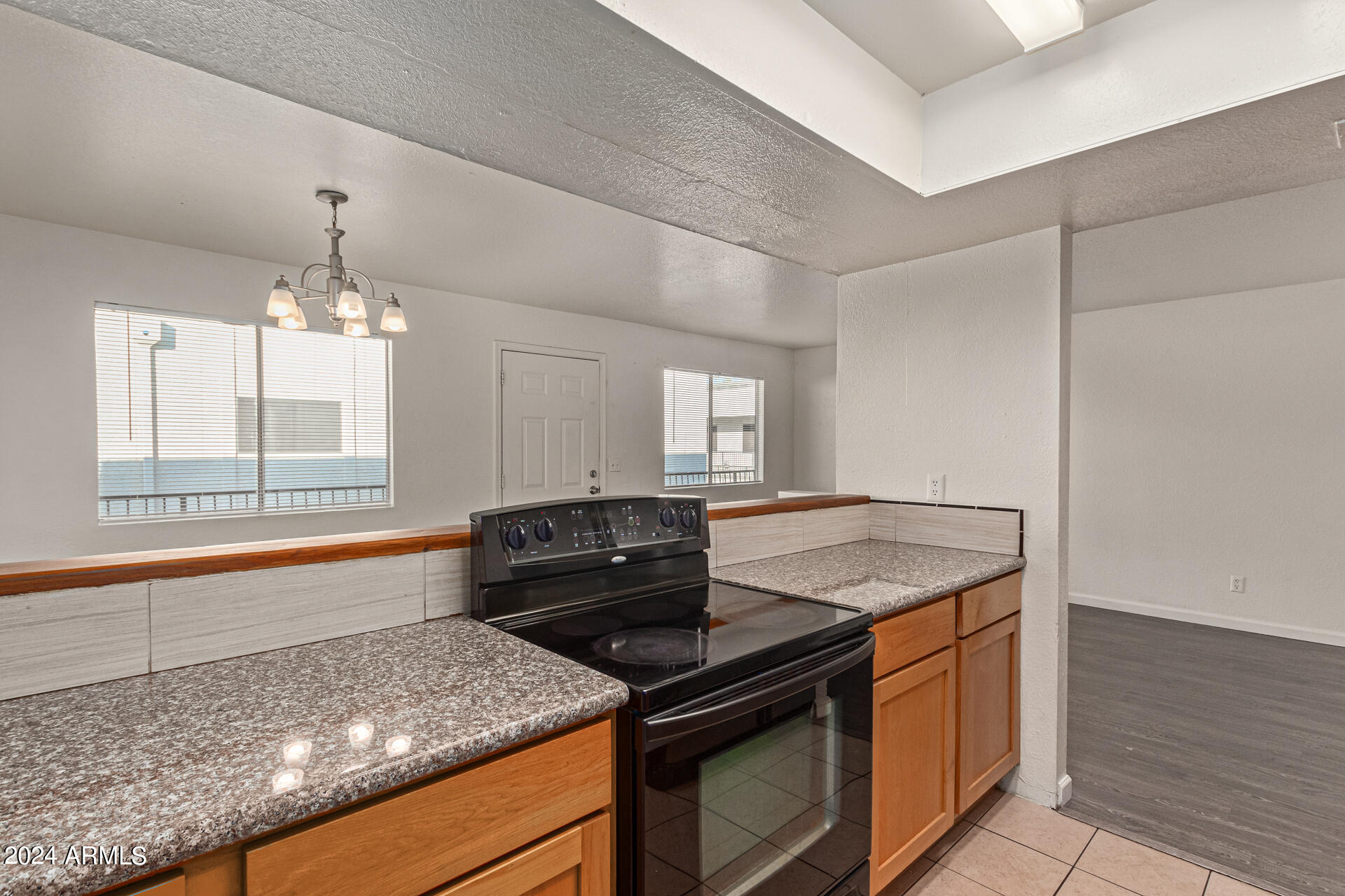 18202 North Cave Creek Road, Unit 228 Phoenix, AZ 85032 - Photo 15 of 31 Upgraded Kitchen with granite counters