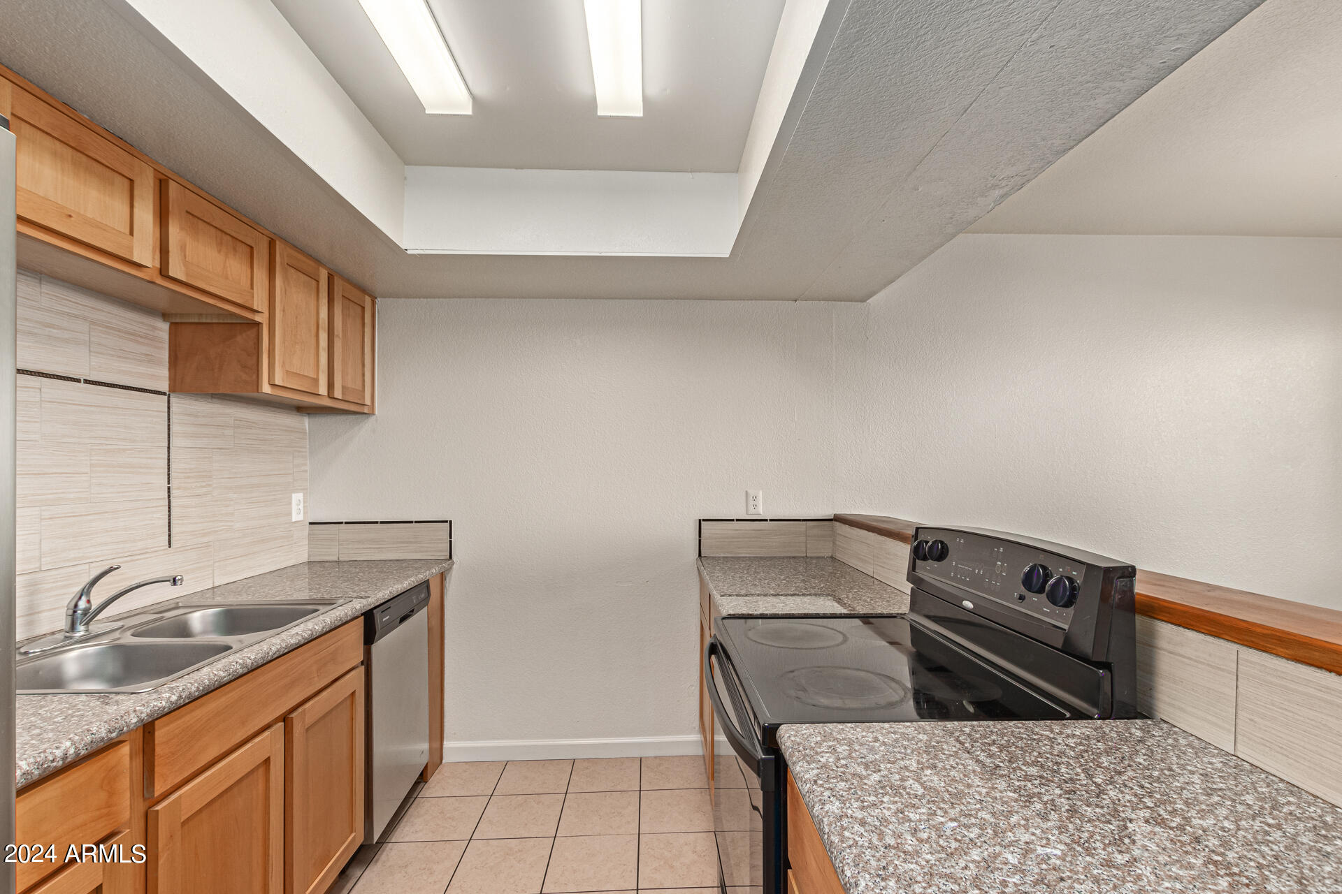18202 North Cave Creek Road, Unit 228 Phoenix, AZ 85032 - Photo 17 of 31 Black and Stainless Appliances