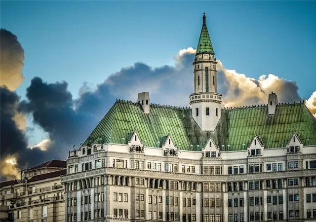 a living room with furniture a flat screen tv and a window