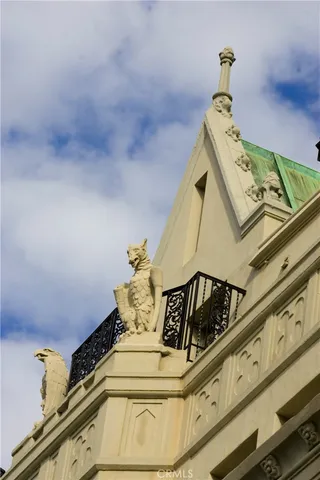 a living room with furniture fireplace and potted plants