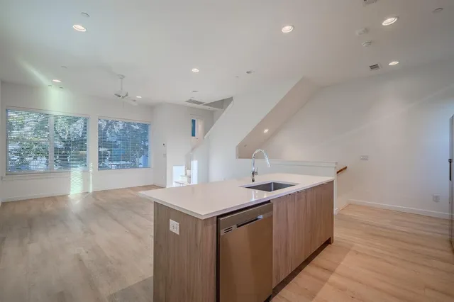 a kitchen with sink and window