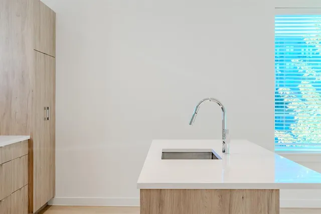 a close view of a sink and a window