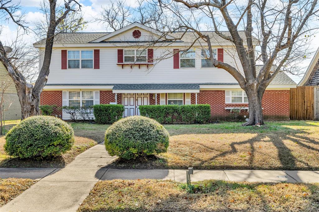 1832 Wonderlight Lane Dallas, TX 75228 - Photo 1 of 39 a front view of a house with garden