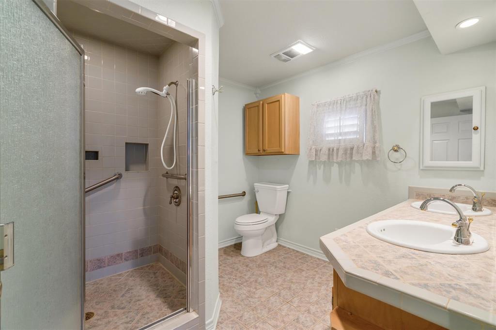 1832 Wonderlight Lane Dallas, TX 75228 - Photo 22 of 39 a bathroom with a sink toilet and shower