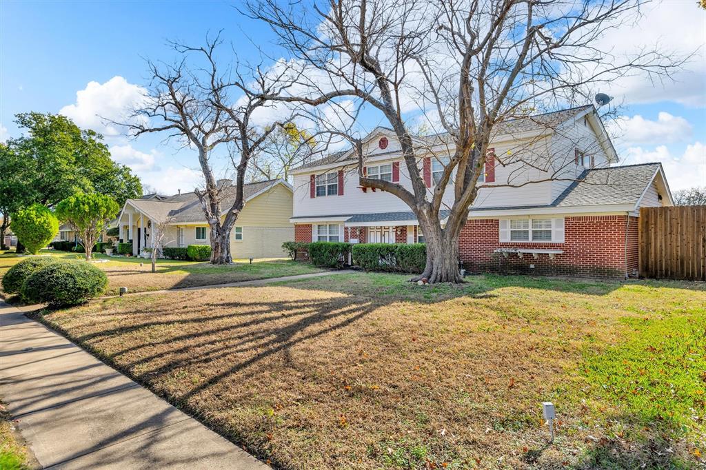 1832 Wonderlight Lane Dallas, TX 75228 - Photo 3 of 39 a view of a house with a yard covered with snow in front of it