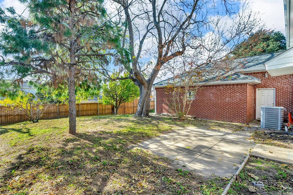1832 Wonderlight Lane Dallas, TX 75228 - Photo 35 of 39 a house with trees in front of it