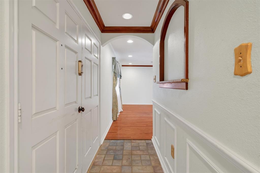1832 Wonderlight Lane Dallas, TX 75228 - Photo 4 of 39 a view of a hallway with wooden floor and staircase