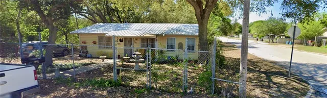 a view of a house with a garden
