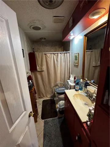 a bathroom with a sink a mirror and a toilet