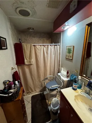 a bathroom with a sink mirror vanity and toilet