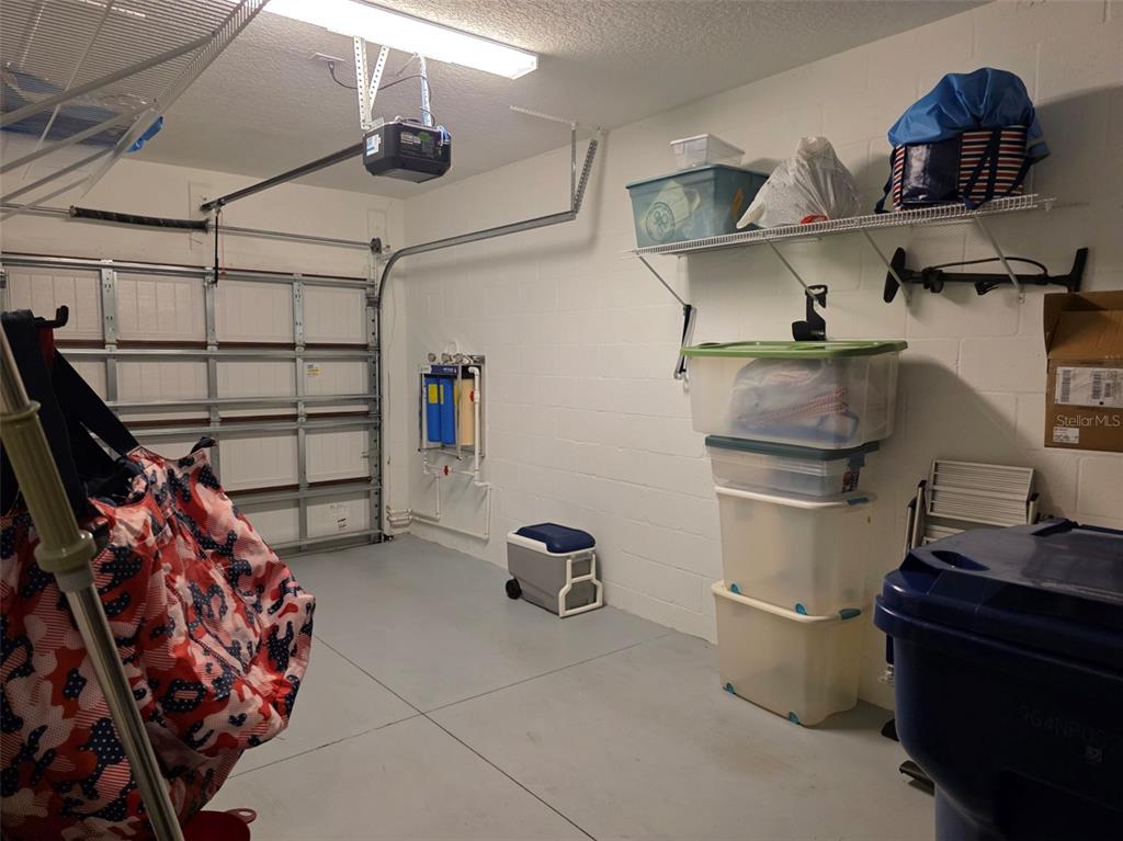 16890 Forge Surf Street Land O Lakes, FL 34638 - Photo 11 of 26 a kitchen with stainless steel appliances granite countertop a sink and cabinets