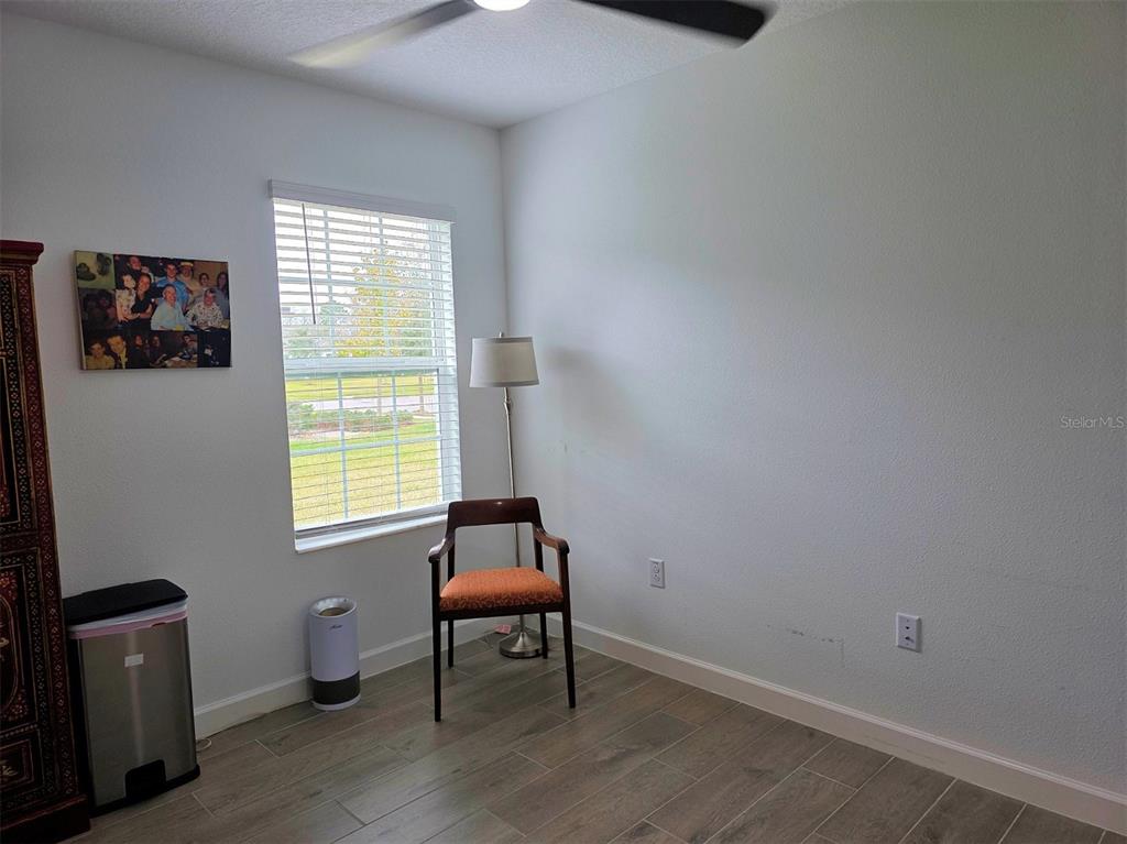 16890 Forge Surf Street Land O Lakes, FL 34638 - Photo 4 of 26 a room with furniture and a window