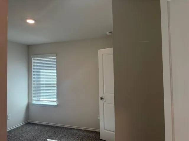 a bathroom with a bathtub and a toilet