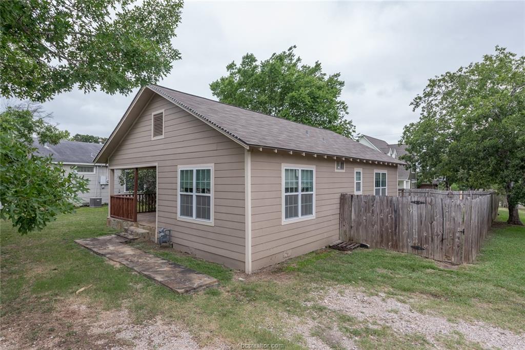 112 Sulphur Springs Road Bryan, TX 77801 - Photo 13 of 17 a view of a house with a yard and wooden fence