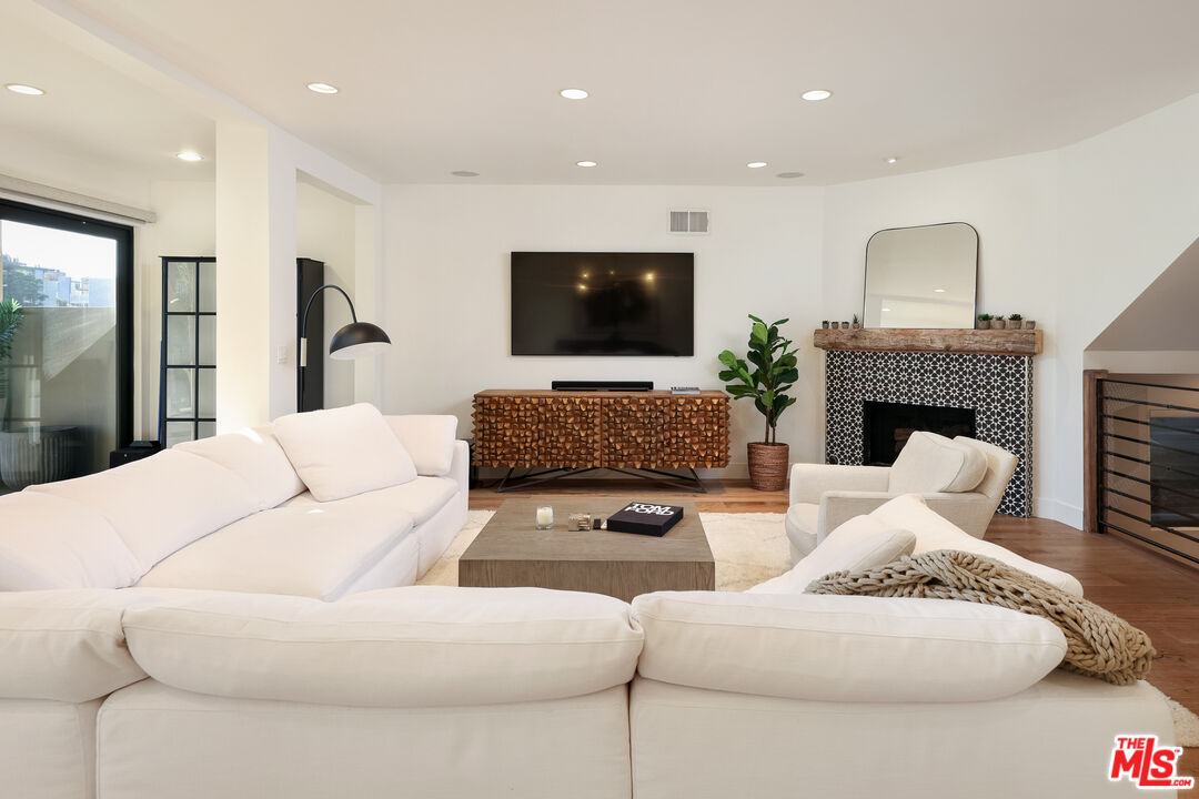 4811 Roma Court Marina del Rey, CA 90292 - Photo 14 of 57 a living room with furniture and a flat screen tv