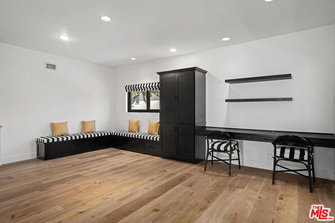 4811 Roma Court Marina del Rey, CA 90292 - Photo 22 of 57 a bedroom with furniture and wooden floor