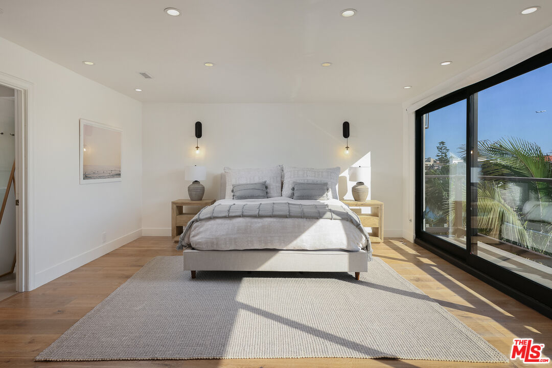 4811 Roma Court Marina del Rey, CA 90292 - Photo 27 of 57 a bedroom with a bed and large window