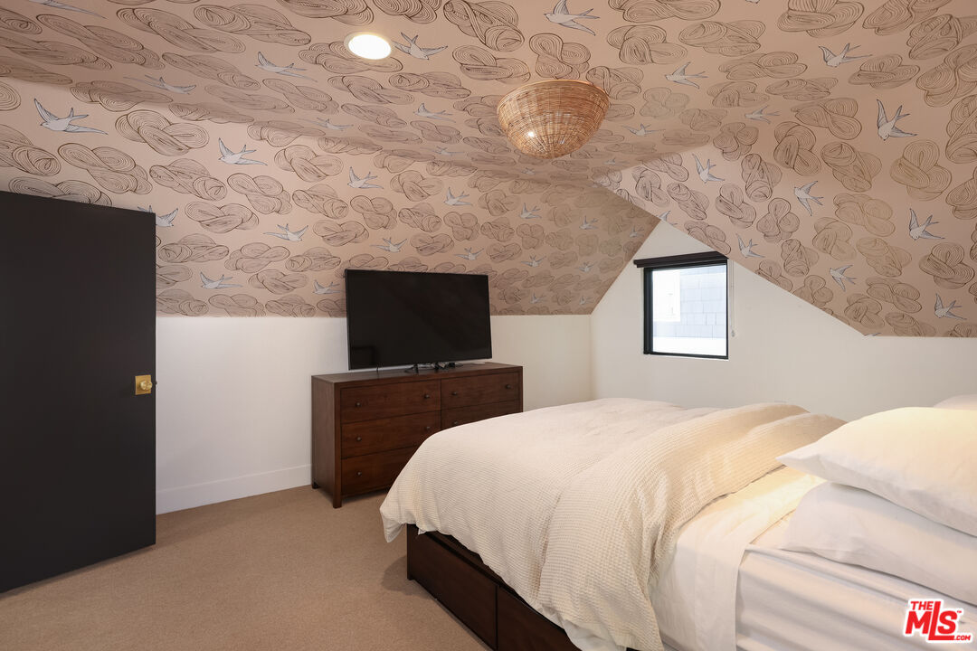 4811 Roma Court Marina del Rey, CA 90292 - Photo 42 of 57 a bedroom with a bed and a television