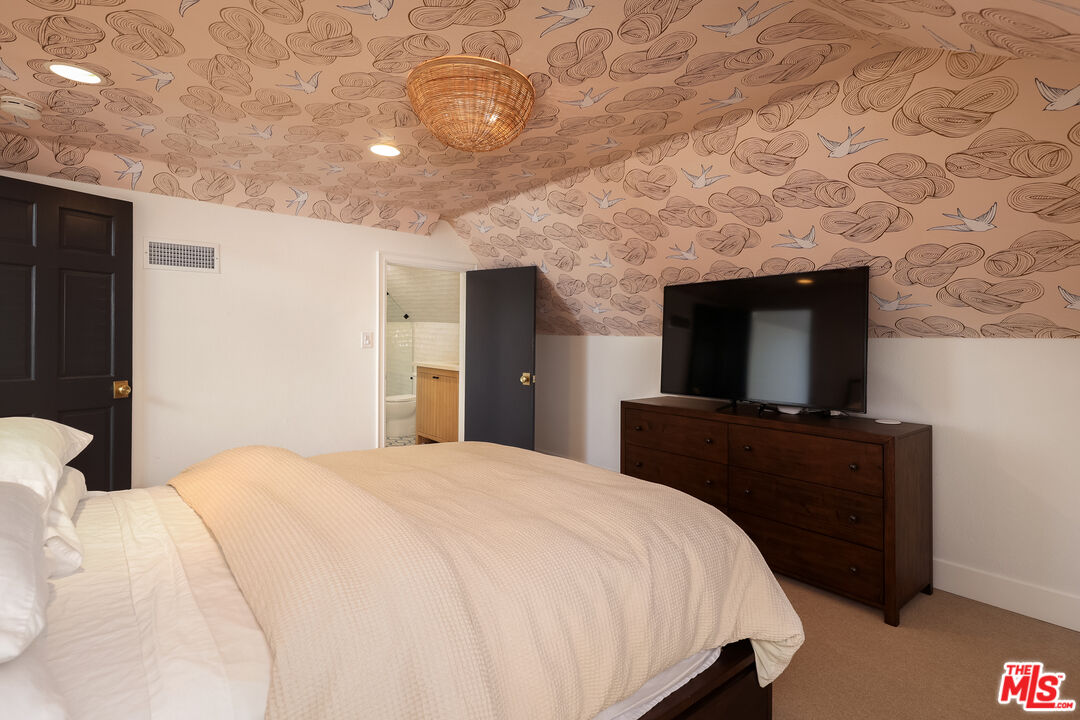 4811 Roma Court Marina del Rey, CA 90292 - Photo 43 of 57 a bedroom with a bed and a flat screen tv