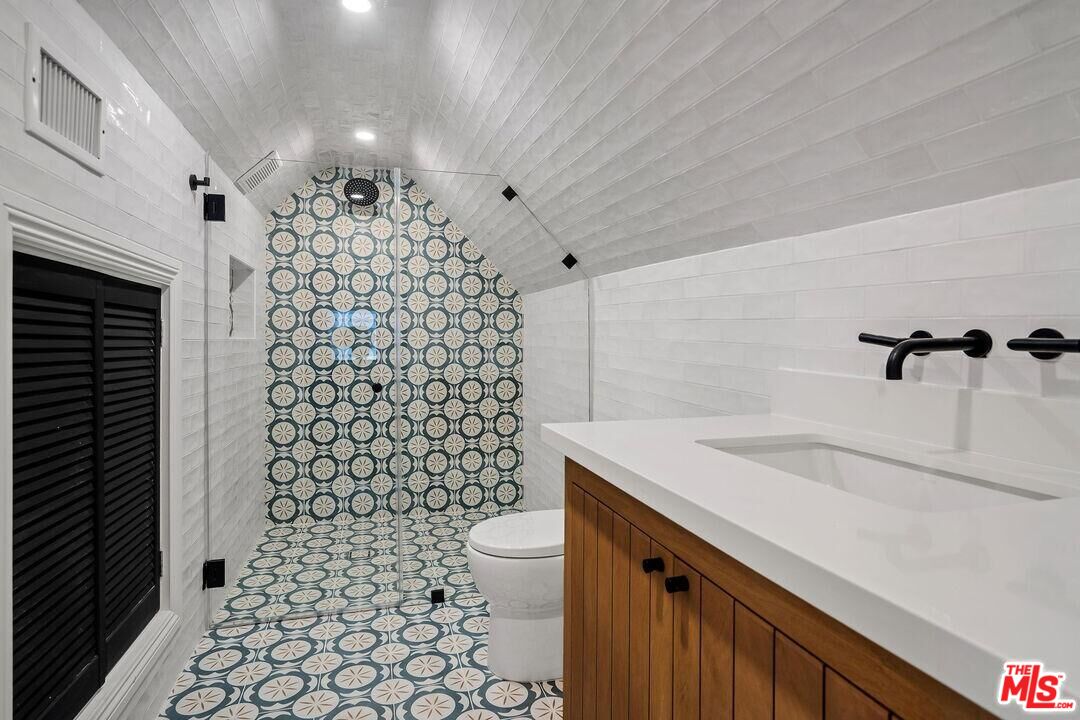 4811 Roma Court Marina del Rey, CA 90292 - Photo 44 of 57 a bathroom with a sink a toilet and shower