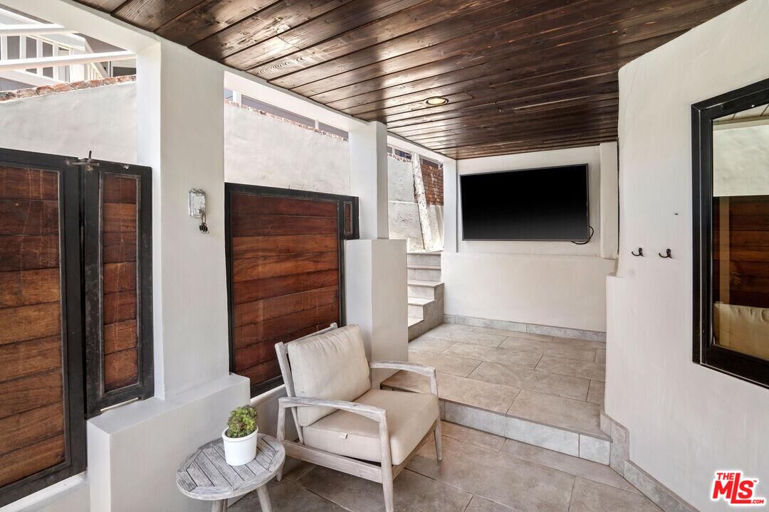 4811 Roma Court Marina del Rey, CA 90292 - Photo 50 of 57 a living room with furniture and a flat screen tv