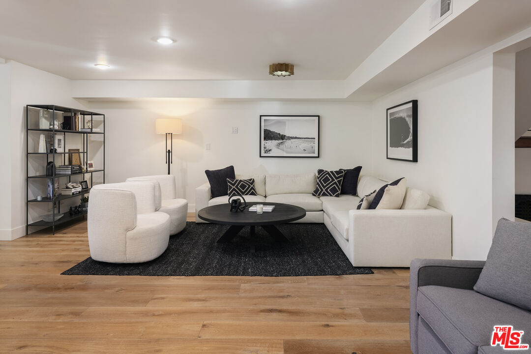 4811 Roma Court Marina del Rey, CA 90292 - Photo 9 of 57 a living room with furniture and wooden floor