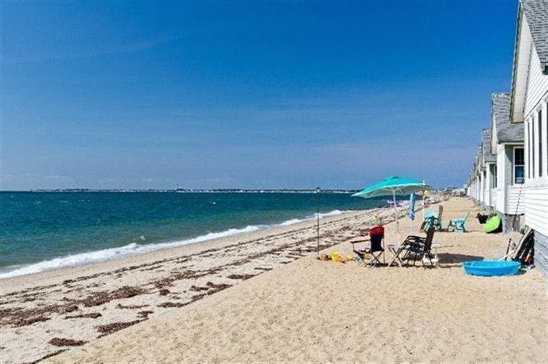 276 Shore Road, Unit 23 Truro, MA 02666 - Photo 3 of 12 a view of a lake with a beach
