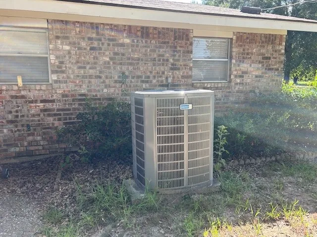 a view of a lake with a house in the background