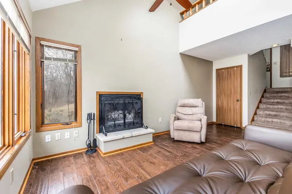 a bedroom with furniture and a window