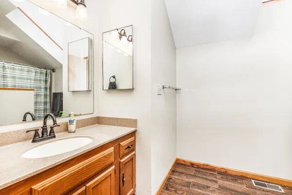 a bathroom with a sink and a mirror