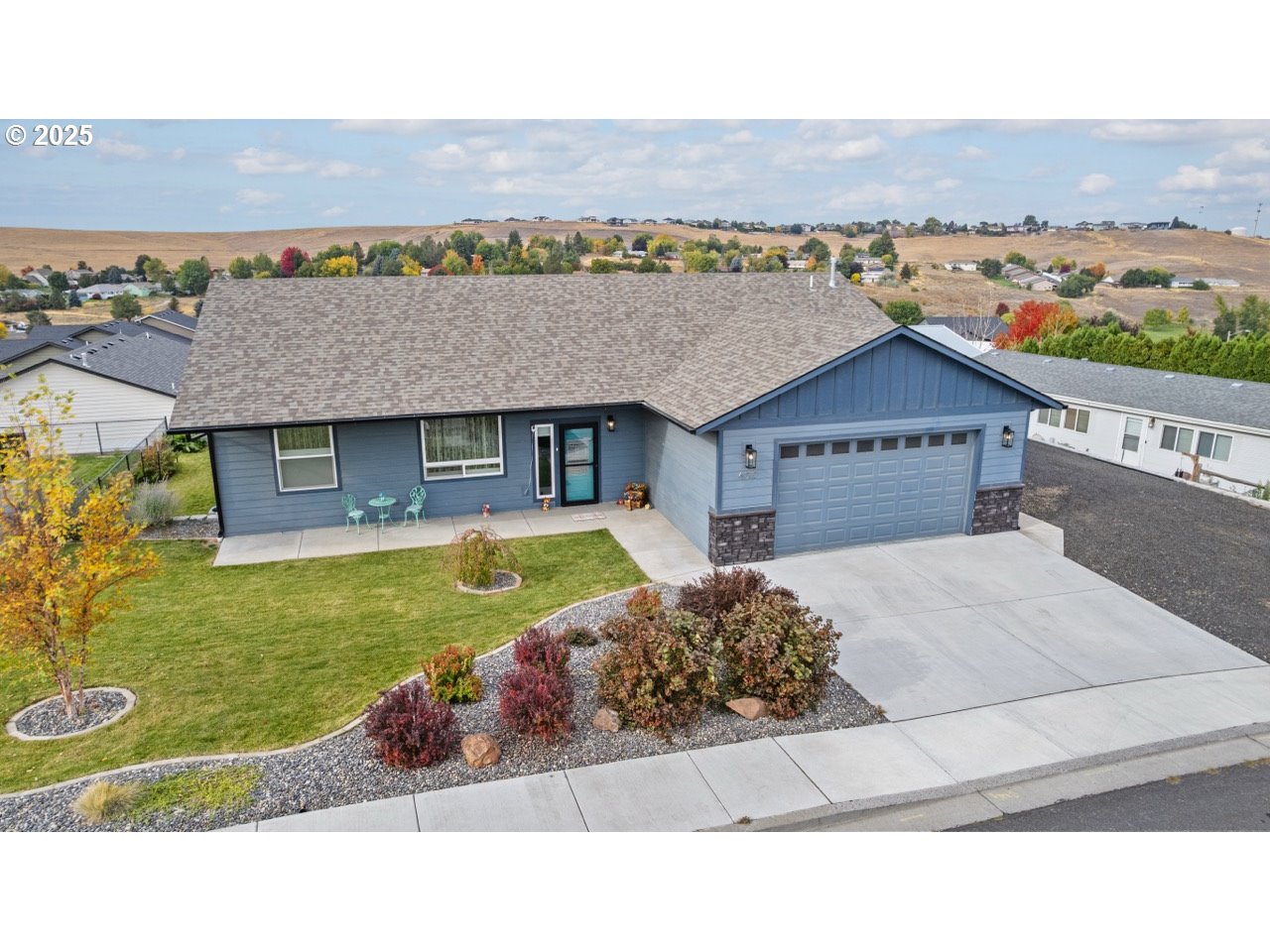a swimming pool with outdoor seating and yard